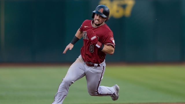 Arizona Diamondbacks outfielder Dominic Fletcher (8) rounds second against the Oakland Athletics at Oakland Coliseum.